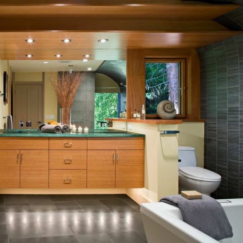 Bathtub, toilet and sink in modern bathroom